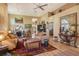 Bright living room with hardwood floors, high ceilings, comfortable sofas, and stylish decor at 4141 Entrada Ct, Sarasota, FL 34238