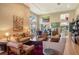 Inviting living room filled with natural light, hardwood floors, comfortable seating, and artistic accents at 4141 Entrada Ct, Sarasota, FL 34238