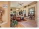 Spacious living room featuring hardwood floors, high ceilings, and comfortable seating arrangement at 4141 Entrada Ct, Sarasota, FL 34238
