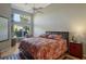Serene main bedroom featuring large windows, ample natural light, and a cozy atmosphere at 4141 Entrada Ct, Sarasota, FL 34238