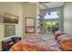Comfortable main bedroom with large windows, TV, and stylish decor for a relaxing retreat at 4141 Entrada Ct, Sarasota, FL 34238