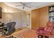Bright office features a versatile layout with ample workspace, comfortable seating and closet at 4141 Entrada Ct, Sarasota, FL 34238