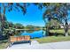 Pond view overlooking a community with walking path and bench, perfect for relaxing walks at 4141 Entrada Ct, Sarasota, FL 34238