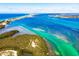 Picturesque aerial view of the aquamarine coastal waters and stunning shoreline at 4210 Overture Cir, Bradenton, FL 34209