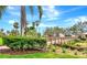 Community bridge surrounded by palm trees and lush landscaping with a blue sky backdrop at 4210 Overture Cir, Bradenton, FL 34209