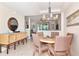 Inviting dining area with a round table, stylish chairs, and a unique chandelier at 4210 Overture Cir, Bradenton, FL 34209