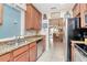 The kitchen has stainless steel appliances, wooden cabinets and granite countertops at 4210 Overture Cir, Bradenton, FL 34209