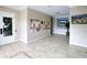 Well-lit lobby area with tiled flooring, bulletin boards, and decorative artwork at 4210 Overture Cir, Bradenton, FL 34209