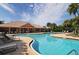 Community pool featuring a large pool, clubhouse, and sun loungers, ideal for relaxation at 4210 Overture Cir, Bradenton, FL 34209