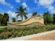 Community sign for Palma Sola Trace with lush landscaping at 4210 Overture Cir, Bradenton, FL 34209