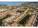 Aerial view of tan condos surrounded by lakes, ponds, landscaping and trees at 4210 Overture Cir, Bradenton, FL 34209