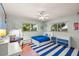 Comfortable bedroom with desk, chair and blue and white accents at 425 Poincianna Dr, Sarasota, FL 34243