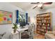 Well-lit office space with built-in bookcase, modern desk, and bright decor at 425 Poincianna Dr, Sarasota, FL 34243