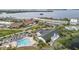 Aerial view of the community featuring a pool, clubhouse and waterfront condos at 4753 Independence Dr, Bradenton, FL 34210