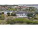 Aerial shot showcases a community with a pool, well-maintained buildings, and lush landscaping at 4753 Independence Dr, Bradenton, FL 34210