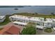 Waterfront condo complex featuring covered parking and beautiful water views at 4753 Independence Dr, Bradenton, FL 34210