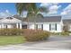 Well-maintained building exterior featuring mature landscaping and a classic design at 4753 Independence Dr, Bradenton, FL 34210