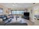 Comfortable living room with water views, ceiling fan and access to the main bedroom at 4753 Independence Dr, Bradenton, FL 34210