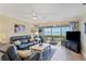 Inviting living room with comfortable seating and sliding glass doors to outdoor living at 4753 Independence Dr, Bradenton, FL 34210