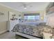 Comfortable bedroom with neutral tones and a large water view at 4753 Independence Dr, Bradenton, FL 34210