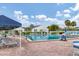 Sparkling pool area with ample seating and views of the well-maintained community at 4753 Independence Dr, Bradenton, FL 34210
