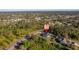 View of a home nestled in a green, wooded area, surrounded by well-spaced houses at 4793 Lovett Rd, North Port, FL 34288