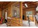 Interior barn showcasing wood paneling, metal gates, and ample space for storage or animal housing at 4871 Hoyer Dr, Sarasota, FL 34241