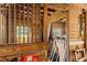 Rustic barn interior showcasing wood paneling, metal gates, and ample space for various purposes at 4871 Hoyer Dr, Sarasota, FL 34241