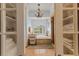 Elegant bathroom with a soaking tub, a walk-in shower, and custom shelving for ample storage at 4871 Hoyer Dr, Sarasota, FL 34241