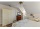 Well-lit bedroom featuring a sloped ceiling, built-in storage, and decorative accents at 4871 Hoyer Dr, Sarasota, FL 34241