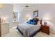 Bedroom with blue accents, soft lighting, and comfortable furnishings at 4871 Hoyer Dr, Sarasota, FL 34241