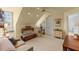 Cozy bedroom with natural light, comfortable seating, and charming decor elements at 4871 Hoyer Dr, Sarasota, FL 34241