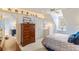Bedroom with blue accents, built-in storage, and comfortable bed at 4871 Hoyer Dr, Sarasota, FL 34241