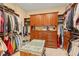 Spacious walk-in closet with custom shelving and ample storage for clothing and accessories at 4871 Hoyer Dr, Sarasota, FL 34241