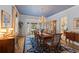 Formal dining room boasting a chandelier, bay window, and elegant décor at 4871 Hoyer Dr, Sarasota, FL 34241