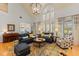 Spacious living room with sofas, area rug and a large arched window with shutters at 4871 Hoyer Dr, Sarasota, FL 34241