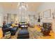 Living room featuring a fireplace, lots of seating and a large window for natural light at 4871 Hoyer Dr, Sarasota, FL 34241