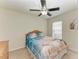 Comfortable bedroom featuring a ceiling fan and ample natural light at 5015 98Th E Ave, Parrish, FL 34219