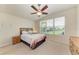 Bright bedroom with a ceiling fan, large window, and neutral color palette at 5015 98Th E Ave, Parrish, FL 34219