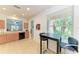 Cozy dining area features a breakfast bar and large windows for natural light at 5015 98Th E Ave, Parrish, FL 34219