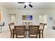 Traditional dining room featuring a ceiling fan, and wood table with seating for six guests at 5015 98Th E Ave, Parrish, FL 34219