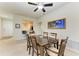 Traditional dining room featuring a ceiling fan, and wood table with seating for six guests at 5015 98Th E Ave, Parrish, FL 34219