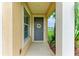Welcoming front door entrance with decorative wreath and neutral-toned walls at 5015 98Th E Ave, Parrish, FL 34219