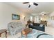 Open concept living room featuring neutral walls, ceiling fans and comfortable seating arrangement at 5015 98Th E Ave, Parrish, FL 34219