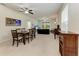 Open living room and dining room with abundant natural light and comfortable seating arrangements at 5015 98Th E Ave, Parrish, FL 34219