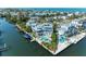 Waterfront home featuring a pool, boat dock, and rooftop deck offering stunning coastal community views at 511 Loquat Dr, Anna Maria, FL 34216