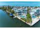 Waterfront home with private pool, boat lift, balconies, and lush landscape at 511 Loquat Dr, Anna Maria, FL 34216