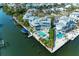 Waterfront home with private pool, boat lift, balconies, and lush landscape at 511 Loquat Dr, Anna Maria, FL 34216