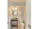 Charming half bathroom with modern fixtures and a decorative bowl sink at 511 Loquat Dr, Anna Maria, FL 34216