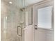 Bathroom features a walk-in shower with white tiling and glass enclosure at 511 Loquat Dr, Anna Maria, FL 34216